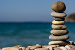 Stones balanced on a rocky beach