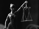 Black and white image of justice scales