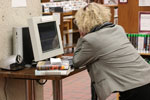 A person at a library catalog computer