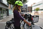A patron checks out a bike at Madison Public Library