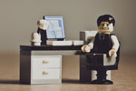 Lego minifig at a desk