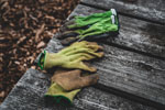 Weeding gloves on a wood deck