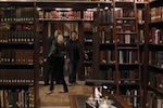 Dark room full of book shelves