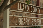 Sign reading Llano County Library System