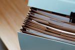 A series of filing folders in a box