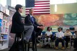 President Barack Obama at Washington, D.C.'s Anacostia Neighborhood Library, being interviewed by a sixth-grade student while other students look on.