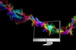 Rainbow light streaming through a computer monitor