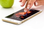 Woman's finger activating a smartphone