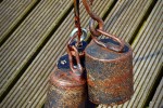 Heavy rusty weights hanging from a chain
