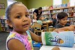 Young girl reading a book