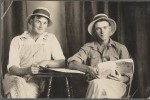 Early 20th-century postcard featuring two men holding books