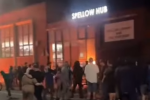 Rioters in front of Spellow Library Hub, in a screencap from Short News