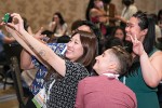 Hayley Park, PhD student at University of Maryland’s College of Information in College Park, snaps a group shot during the Spectrum Leadership Institute