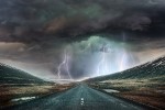 Storm clouds and lightning on a highway