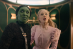 Screen cap from Wicked showing Elphaba and Glinda looking awestruck