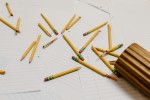 Broken pencils spilled from a holder