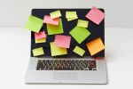Laptop computer covered with sticky notes