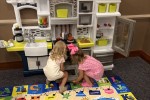 Two girls play at Marshall County Library