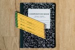 Composition book with pencils