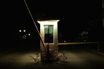 Lit gatehouse at night