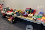 Table full of school supplies at the Toy and Clothing Exchange