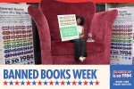 Tiwanna Nevels, assistant state librarian at State Library of North Carolina in Raleigh, in the Big Chair at the 2025 ALA Annual Conference, holding a sign that says I Believe in the Freedom to Read
