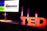 Speaker on a TED Democracy Live stage