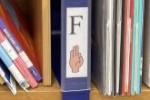 Bookshelf label containing the letter F in both printed English and American Sign Language