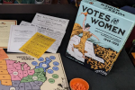 Box cover and some of the game materials for Votes for Women
