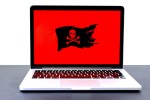 Laptop displaying a pirate flag on its monitor