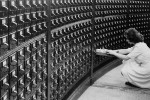 Woman using a large card catalog at the Library of Congress