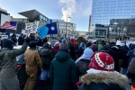 Crowd of people protesting outside Minneapolis Central Library.