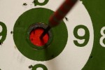 Close-up of an arrow sticking into the bullseye of a target