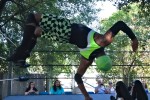 Lucha Libro wrestler flipping during a bout at Dixon Library