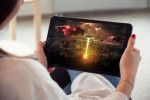 Woman watching video on a tablet computer
