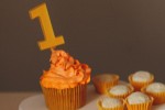 Cupcake with a 1 candle sticking out of it.