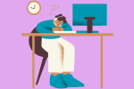 Person napping at a computer desk.