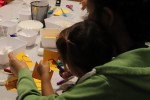 Parent and child working on a paper craft together