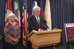 Texas Lt. Gov. Dan Patrick at a press conference with conservative activist Bonnie Williams and a cover of Push, one of 2200 'dirty' books on his list.
